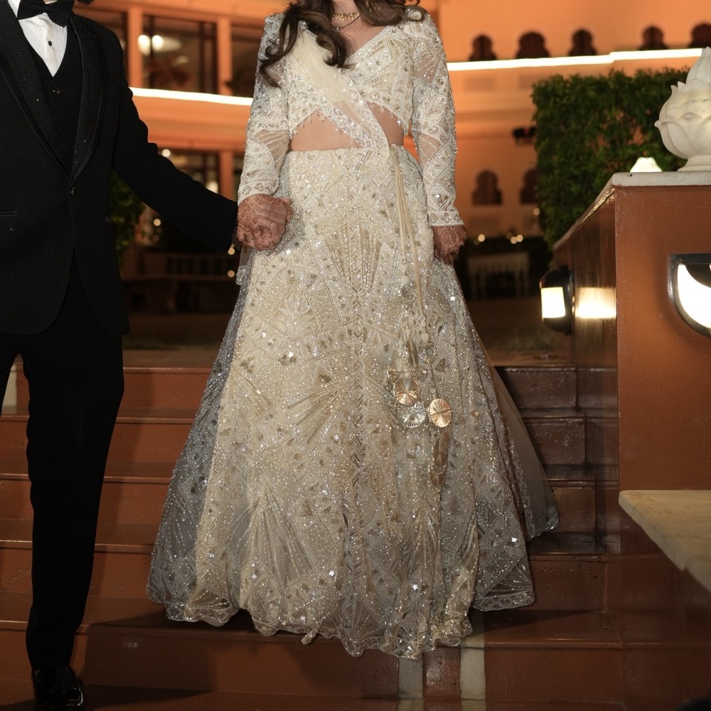 White heavily embroidered lehenga